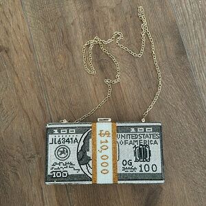 Fun gemmed $10,000 purse. Strap can be worn in or out if purse.